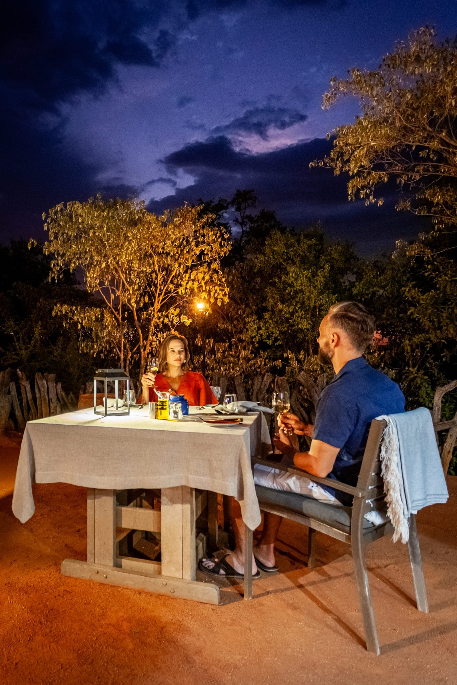 A private candlelit dinner set up in the bush at Madikwe Hills.