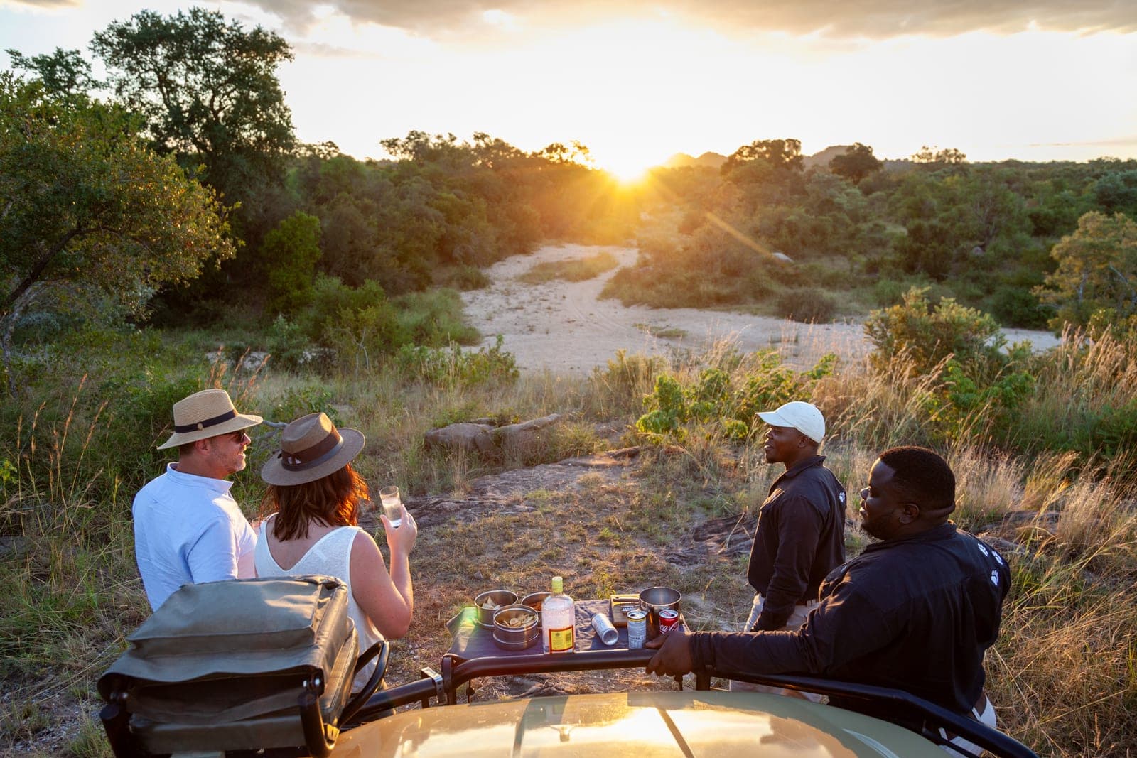 Sundowner drinks at sunset on a game drive in the Sabi Sand.