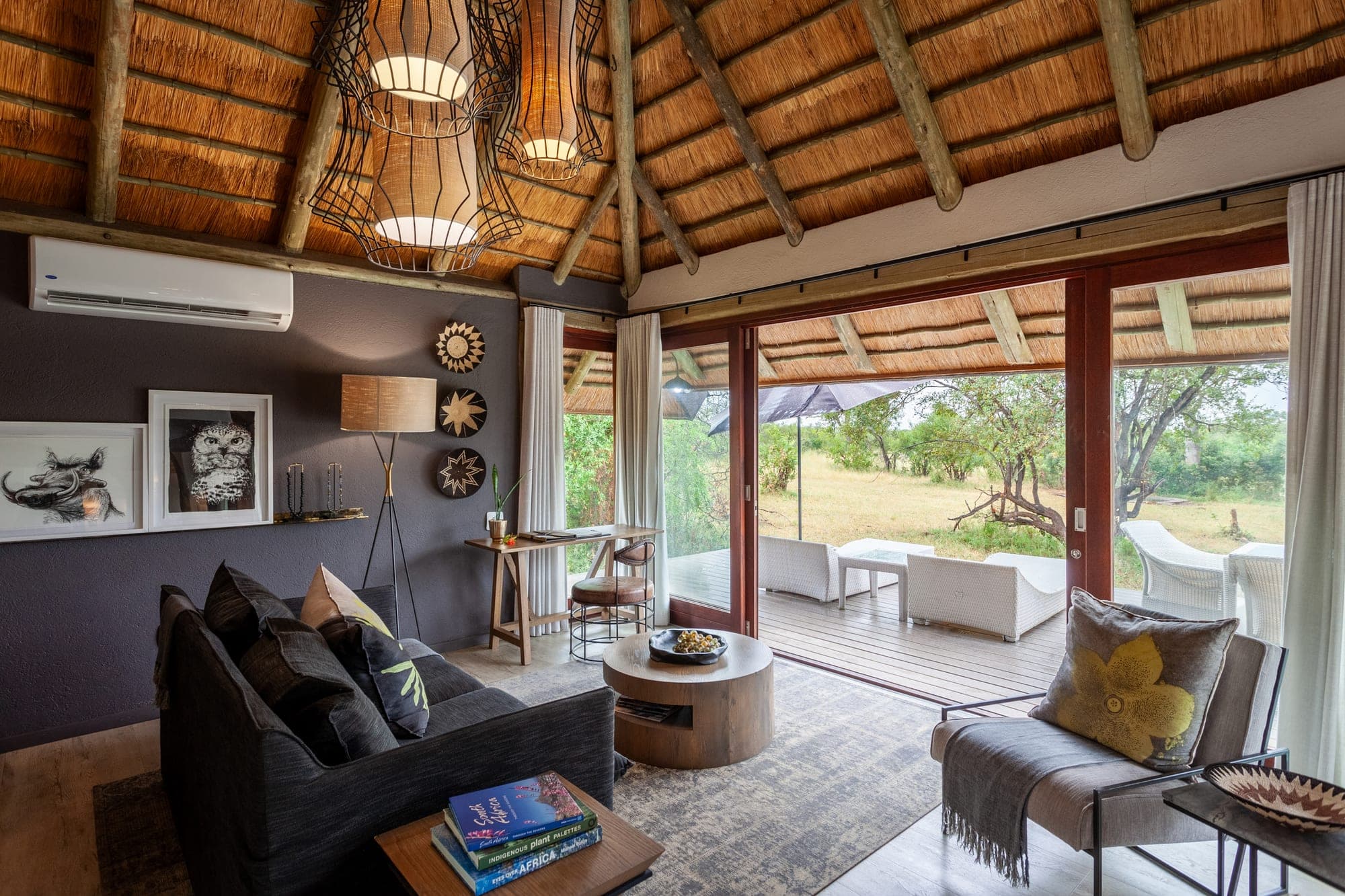 A glass-fronted luxury suite opening onto the Sabi Sand at Leopard Hills.